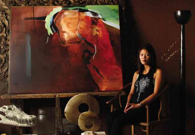 JANA Benitez in her universe: The animal skull and the stones capture the ambiguous silhouette in the artist’s work.