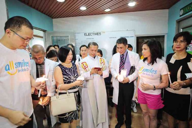 BELOleads staff of BMGand José Reyes Memorial Medical Center during the blessing of the hospital’s post-anesthesia care unit, which BMGhelped refurbish. PHOTOS BY JILSON SECKLER TIU
