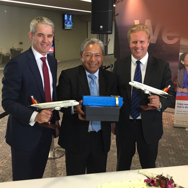 PHILIPPINE Airlines President Jaime Bautista exchanges gifts with Adrian Littlewood, chief executive of Auckland International Airport, and Todd McClay, New Zealand’s associate minister of foreign affairs and trade. 
