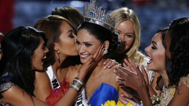 Other contestants congratulate Miss Philippines Pia Alonzo Wurtzbach after she was crowned Miss Universe at the Miss Universe pageant Sunday, Dec. 20, 2015, in Las Vegas. According to the pageant, a misreading led the announcer to read Miss Colombia Ariadna Gutierrez as the winner before they took it away and gave it to Miss Philippines. (AP Photo/John Locher)