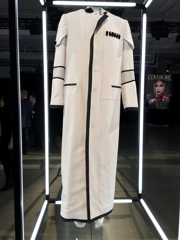 A floor-length boxy white coat with black trim designed by Ovadia & Sons, inspired by the film, "Star Wars: The Force Awakens," is displayed at a gallery on Wednesday, Dec. 2, 2015, in New York. Fashion designers created outfits that pays homage to characters from the film as part of the "Force 4 Fashion," initiative. The outfits will be auctioned off with proceeds going to the Child Mind Institute. (AP Photo/Jocelyn Noveck)