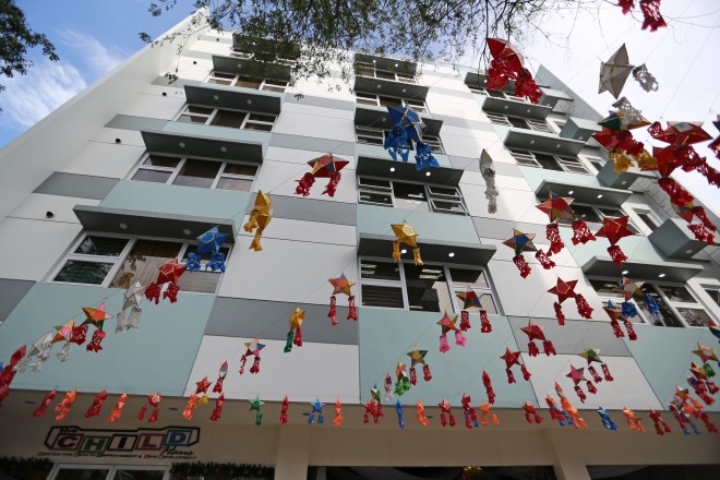THE SEVEN-STORY Child Haus in Paco,Manila, is festooned with Christmas decor during its inauguration on Sunday. The center shelters children with cancer from out of town undergoing treatment at the Philippine General Hospital, a 5-minute walk away. RAFFY LERMA