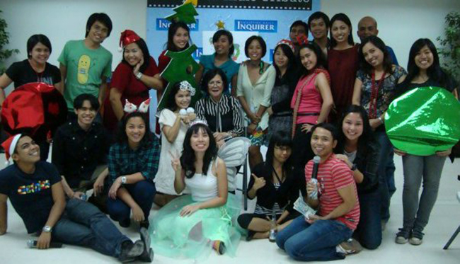 LIFE OF THE PARTY. LJM joins the “class picture” during the editorial production assistants’ Holiday costume party in 2010. COURTESY OF VANESSA HIDALGO