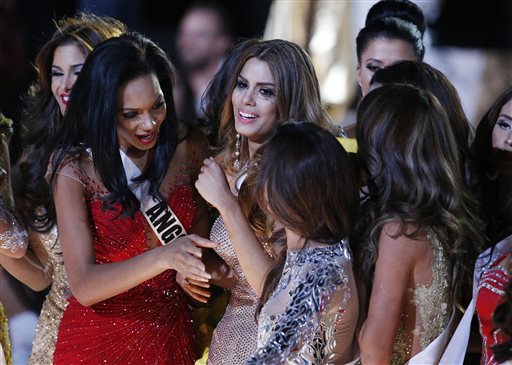 Other contestants comfort Miss Colombia Ariadna Gutierrez, center, after she was incorrectly crowned Miss Universe at the Miss Universe pageant Sunday, Dec. 20, 2015, in Las Vegas. According to the pageant, a misreading led the announcer to read Miss Colombia Ariadna Gutierrez as the winner before they took it away and gave it to Miss Philippines Pia Alonzo Wurtzbach. AP