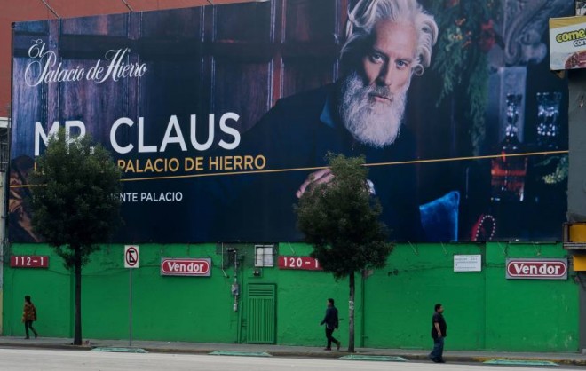 A billboard for a department store advertises Mr. Claus for the Christmas season Friday in Mexico City. AFP