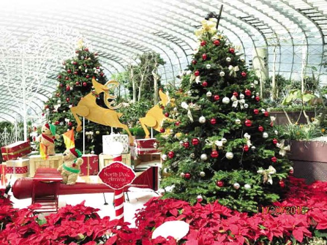 CHRISTMAS trees richly decorated with ornaments greet visitors at the entrance.