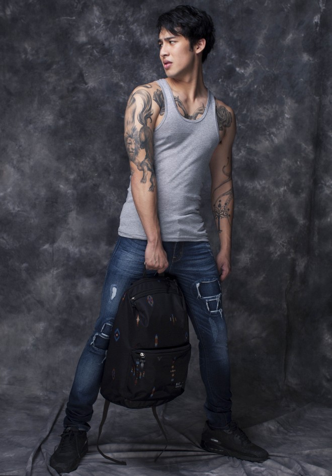 BASIC gray tank top, Bench Body; tattered skinny jeans, Bench; ‘Ikat’ print backpack, Brownbreath, available at Bench Edited