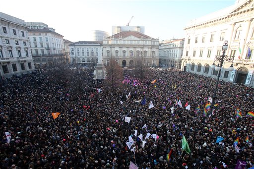 In this Friday, Jan. 23, 2016 file photo, people gather during a gay rights demonstration in Milan, Italy. On Thursday, Jan. 28, 2016 the Italian Senate will plunge into a debate on proposed legislation to grant legal recognition to ''civil unions,'' including of homosexual couples, without equating those partnerships to marriage. AP