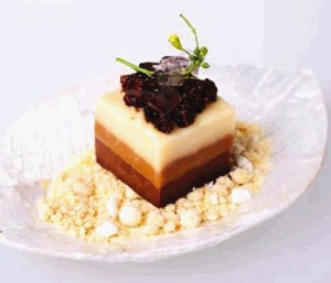 “SAPIN-SAPIN” (native rice cake) is apportioned so the different layers are visible.