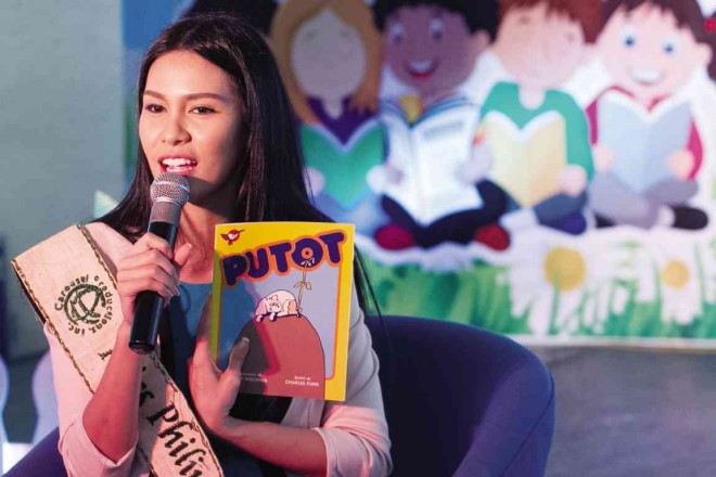 MISS PHILIPPINES-EARTH 2015 Angelia Ong reads “Si Putot” in the last session of Festival Day 1.