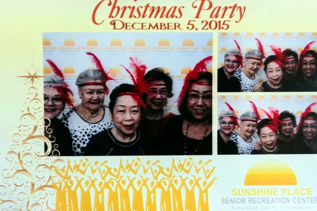 Having a ball at the photo booth during the club's Christmas party