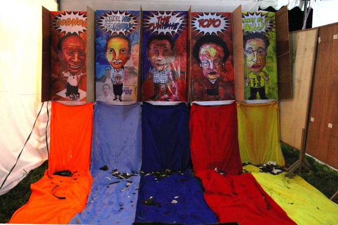CARICATURES of the candidates for President in a plate- and water balloon-throwing booth PHOTO BY KATRINA ARTIAGA