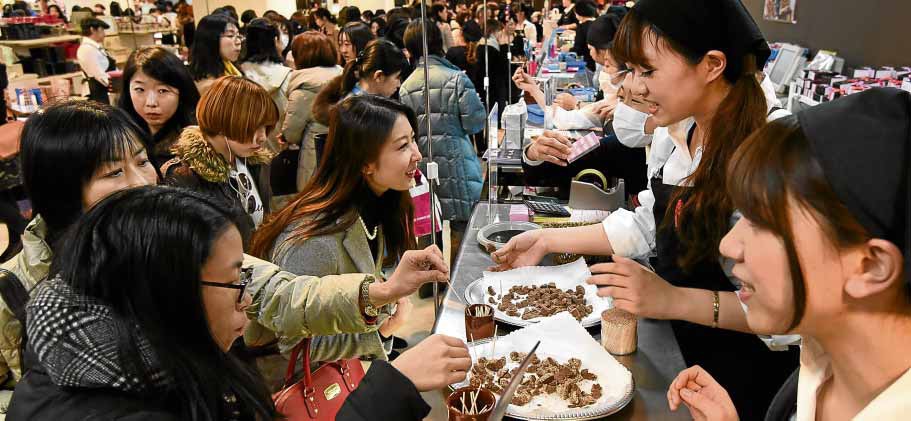 THE WAY TO A MAN’S HEART Japanese women brought stores in Tokyo to a standstill on Tuesday as they elbowed each other out at the chocolate counter stocking up on Valentine chocolates for the men in their lives. AFP