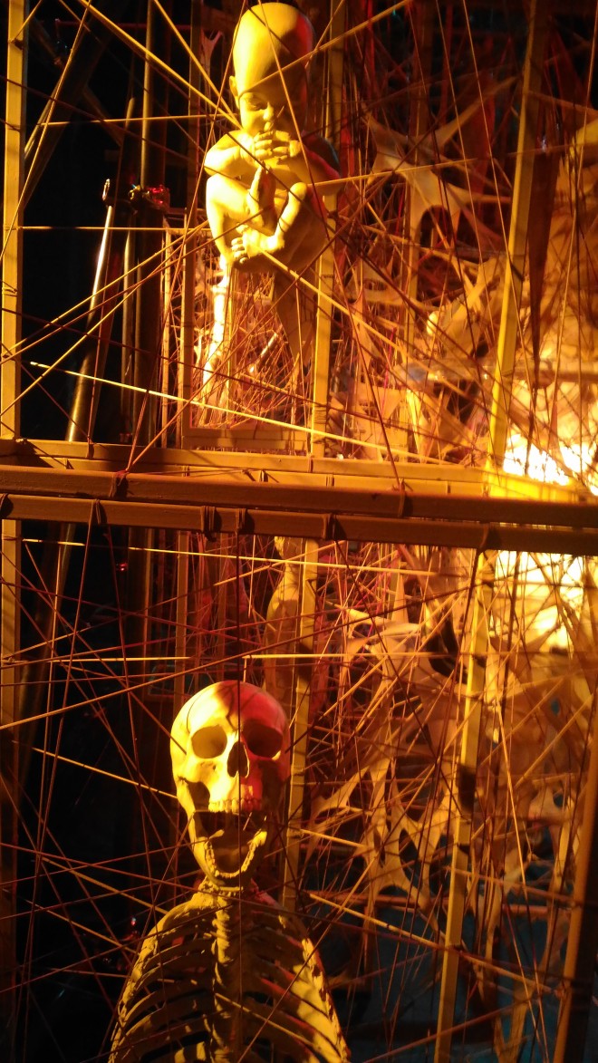Screaming skull in a web of skeleton in "Opera" stage design. TOTEL V. DE JESUs