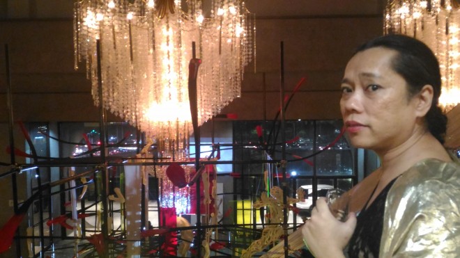 The expressive, inquisitive eyes of filmmaker Moira Lang say a lot about the chandelier on top of Gabby Barredo's installation art at the CCP main lobby. TOTEL V. DE JESUS