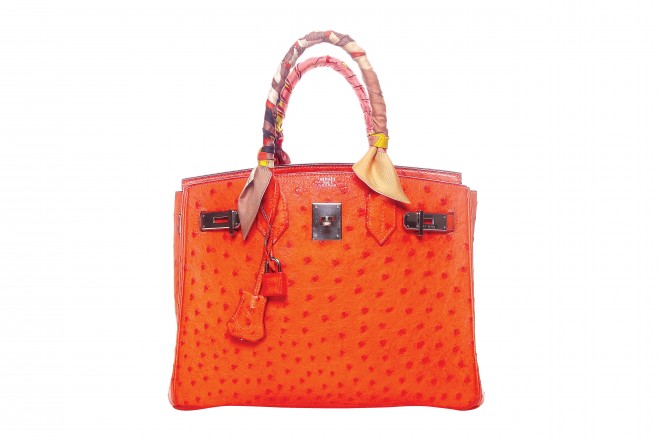 Heart Evangelista has a buying principle: she never buys a bag unless it’s a Birkin or a Kelly, the most iconic and sought-after bags in the whole world. Her most prized possession to date is this gorgeous Hermès “Birkin” handbag made of genuine ostrich leather in tangerine orange with palladium hardware. She made the look personalized with a silk scarf on the handles. It was said that since high-quality ostrich skins have become hard to find, Hermès has discontinued making bags of this kind of leather. “I don’t think I’ll ever spend so much on a bag again, but you know, it was something that I had to do only once,” says Heart.