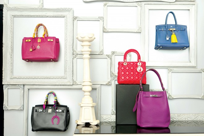 (FROM TOP LEFT) 35 cm ‘Birkin’ bag in Tosca and calfskin leather and classic black ‘Birkin’ in Noir and calfskin leather, both from Hermès; ‘Lady Dior’ in red, Christian Dior; ‘So Kelly’ shoulder bag in Cassis, and 35 cm ‘Birkin’ in Blue Tempéte, both from Hermès