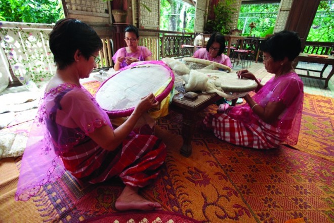 LUMBAN embroiderers use bamboo hoops for precise workmanship. PHOTOS BY AT MACULANGAN