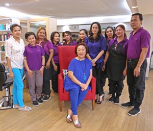 YUCHENGCO, seated, with Ana Asis (in purple), Josie Gacutan (leftmost), and the rest of the Vivify staff