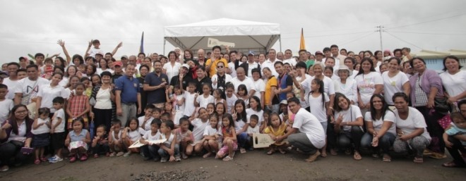 ALL THE families who received the keys to their newly built houses in the Peninsula-GK village in Tanauan, Leyte