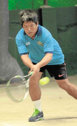 FR. FERNANDO Suarez, shown here doing two-handed strokes and known to most as the “healing priest,” has been playing tennis even before the priesthood. After learning that many of his colleagues are also into tennis, Suarez organized the tournament that is now on its seventh year. PHOTOS BY RUDY LIWANAG