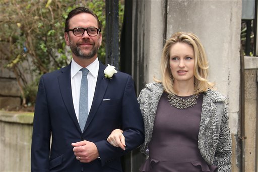 James Murdoch, left, and Kathryn Hufschmid arrive at St Bride's Church for the celebration ceremony of the wedding of Rupert Murdoch and Jerry Hall in London, Saturday, March 5, 2016. (Photo by Joel Ryan/Invision/AP)