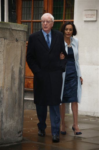 Michael Caine, left, and Shakira Caine arrive at St Bride's Church for the celebration ceremony of the wedding of Rupert Murdoch and Jerry Hall in London, Saturday, March 5, 2016. (Photo by Joel Ryan/Invision/AP)