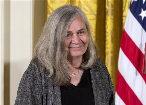 FILE - In this July 10, 2013, file photo, Marilynne Robinson appears at a ceremony awarding her the 2012 National Humanities Medal for  grace and intelligence in writing in the East Room of White House in Washington. Robinson, the acclaimed author of such novels as Gilead and Housekeeping, is this years winner of the Library of Congress Prize for American Fiction, a lifetime achievement honor. (AP Photo/Carolyn Kaster, File)