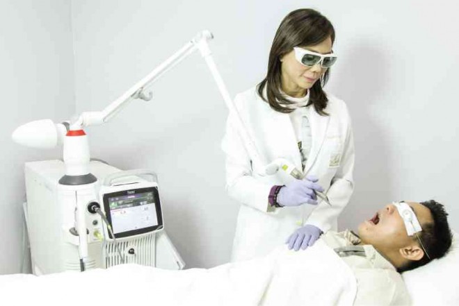 DR. VICKI Belo treating a patient with Nightlase