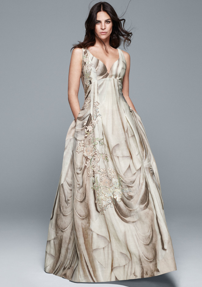 JULIA Roitfeld in a "Pandora dress"  A shapely ball gown with deep neckline and trompe l’oeil print mimicking a marble draping upon which are applied clusters of flower-shaped patches further embroidered with small flower motifs. The dress is made of organic linen and silk, while patches are made of organic hemp and silk.  