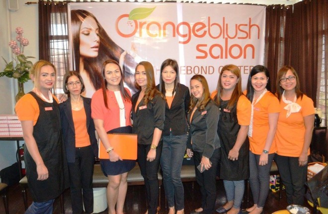 "It's just, a little blush..." as that Jennifer Paige song sounds like. LGBT rights advocate Bemz Benedito with the friendly, efficient staff members of Orange Blush Salon. CONTRIBUTED PHOTO/Ariel Reyes
