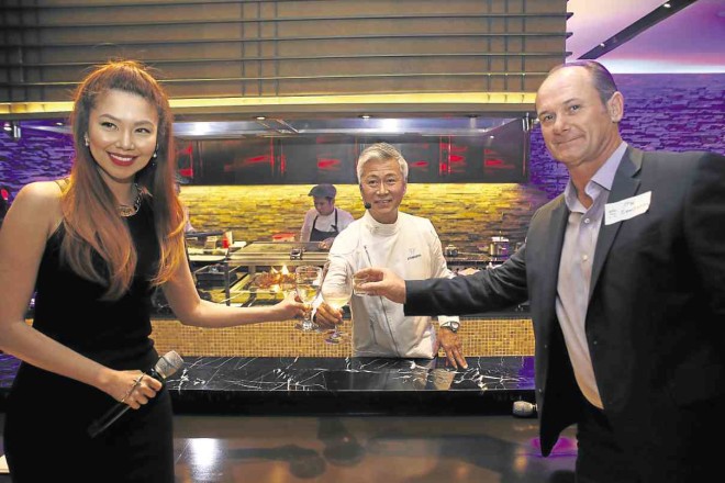 VISA country manager for the Philippines and Guam Stuart Tomlinson (right), together with chef Hide Yamamoto and Bianca Valerio, leads the toast to celebrate the launch of the bigger and better Epic Dining by Visa.