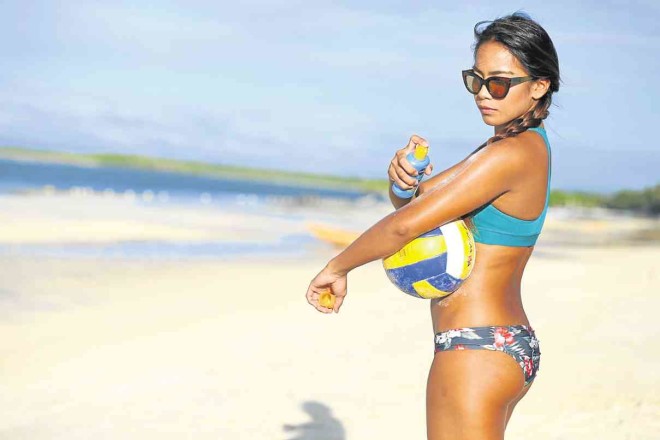 ATHLETE Charo Soriano appliesNivea’s Protect and Bronze before playing a round of beach volleyball in Panglao Island, Bohol.