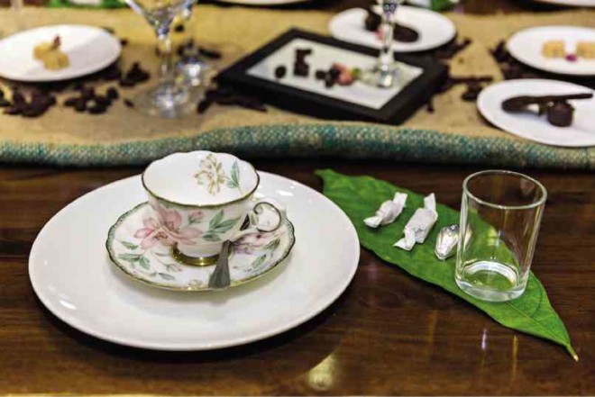 NATURAL elements such as cacao leaf complement the floral design of the cup and saucer.