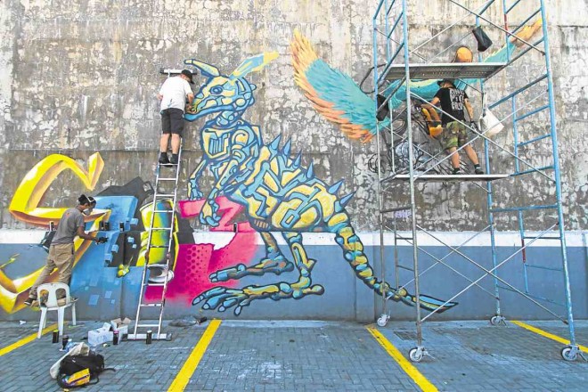 INTERNATIONAL graffiti artists work on their pieces duringMOSPH 2016 PHOTOS BY ALEXIS CORPUZ