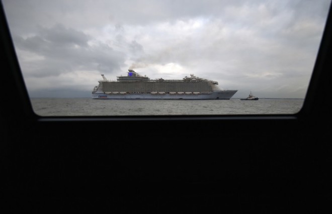 This file photo taken on March 10, 2016 shows the Harmony of the Seas ship cruise leaving the STX shipyard in Saint-Nazaire, western France, for a three-day test offshore.  STX France will deliver on May 12, 2016 in Saint-Nazaire the Harmony of the Seas, the largest cruise ship ever built, to US owner Royal Caribbean Cruises Ltd (RCCL). / AFP 