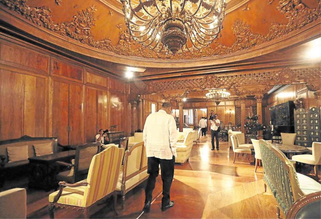 GHOST OF BEDROOM PAST Outgoing President Aquino seems to turn his back on the frills of public office as he leads a tour of Malacañang for Inquirer editors. This chamber, with its opulent chandelier and fancy ceiling used to be former first lady Imelda Marcos’ bedroom, he said. JOAN BONDOC   