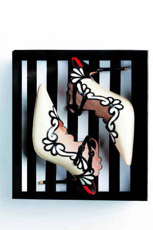 ‘Sariya’ mules by SOPHIA WEBSTER She satisfies her playful side with a pair of Sophia Webster heels.