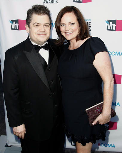 In this Jan. 12, 2012 file photo, Patton Oswalt, left, and his wife Michelle Eileen McNamara arrive at the 17th Annual Critics' Choice Movie Awards in Los Angeles. AP