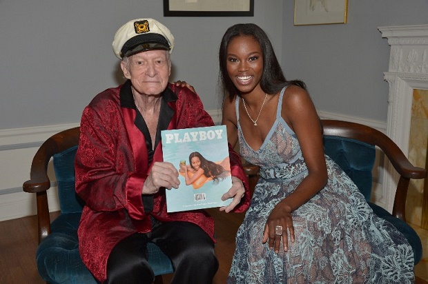 Playboy Founder and Editor-In-Chief Hugh M. Hefner poses with 2016 Playmate of the Year Eugena Washington at Playboy's 2016 Playmate of the Year Announcement at the Playboy Mansion on May 11, 2016 in Los Angeles, California. AFP