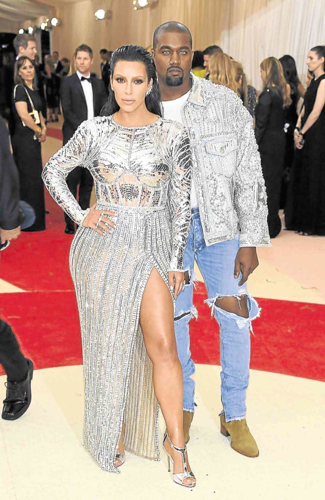 POWER couple Kim Kardashian and Kanye West in pearls and silver outfits by Balmain