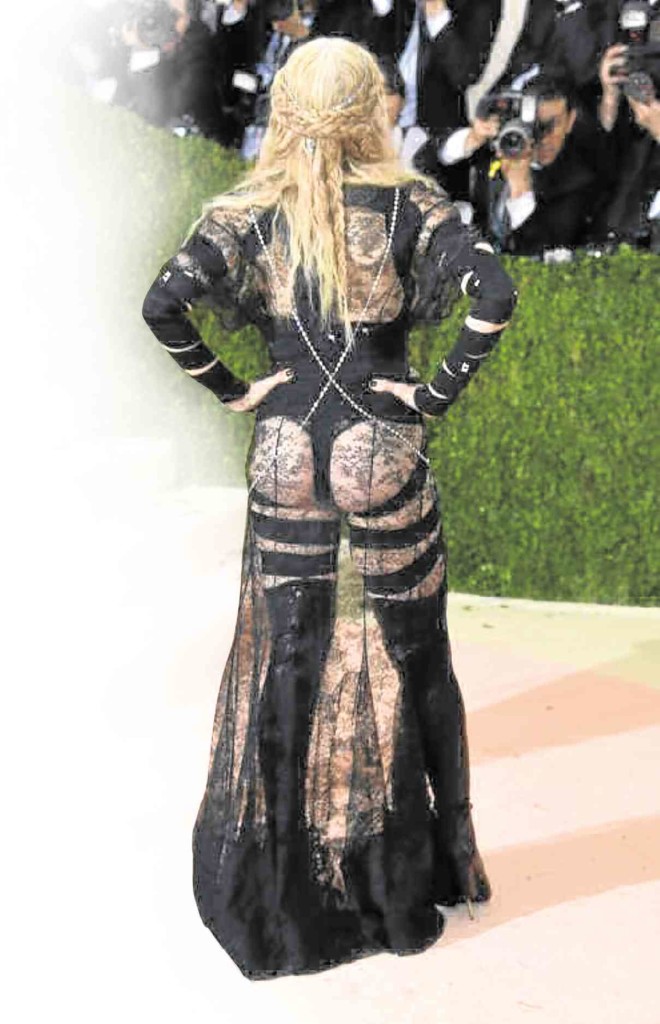 MADONNA bares her behind in Givenchy by Ricardo Tisci.