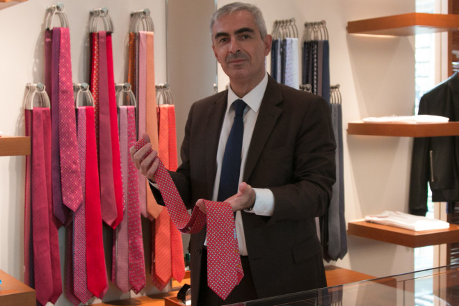 Festy holding some of the brand’s vibrant silk ties
