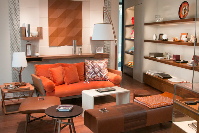 Plush couch, coffee tables, side table and leather-trimmed lamps from Maison Hermès