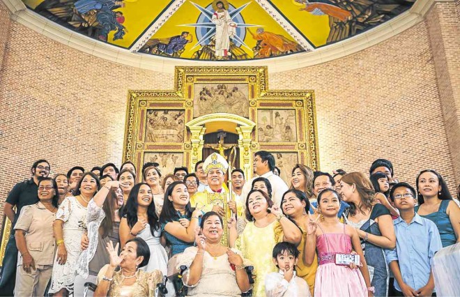 NEWLY consecrated bishop is joined for a photo-op by his family and friends. PHOTOS BY JILSON SECKLER TIU