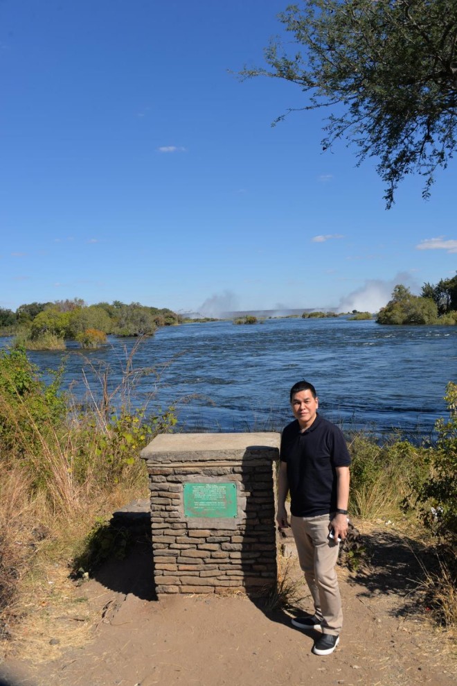 BEN Chan posing beside the Zambezi River 