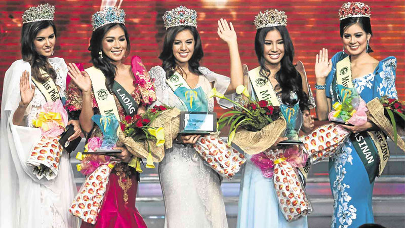 A NIGHT OF BEAUTY  German-Filipino Imelda Schweighart (middle) captures the Miss Philippines Earth title  on Saturday night  at the University of the Philippines Theater in Diliman, Quezon City. With her are, from left: Melanie Mader, Miss Philippines Ecotourism; Loren Artajos, Miss Philippines Water; Kiara Giel Gregorio, Miss Philippines Air; and Shannon Rebecca Bridgman, Miss Philippines Fire. LEO M. SABANGAN II 