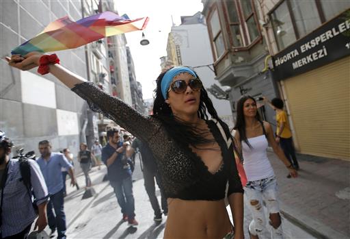 People protest against the ban on a gay pride march, off Istiklal Avenue, central Istanbul's main shopping road, Sunday, June 19, 2016.  The Green Party lawmaker Volker Beck, an outspoken activist for gay rights, was detained Sunday when he wanted to speak publicly at "Pride Week” in Istanbul. AP