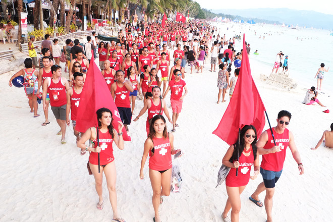 Volunteers join the #SaveSexy march during the LaBoracay weekend. Leading them are Manhunt International Philippines 2015 Don McGyver Cochico and Red Whistle youth ambassador Katarina Rodriguez.