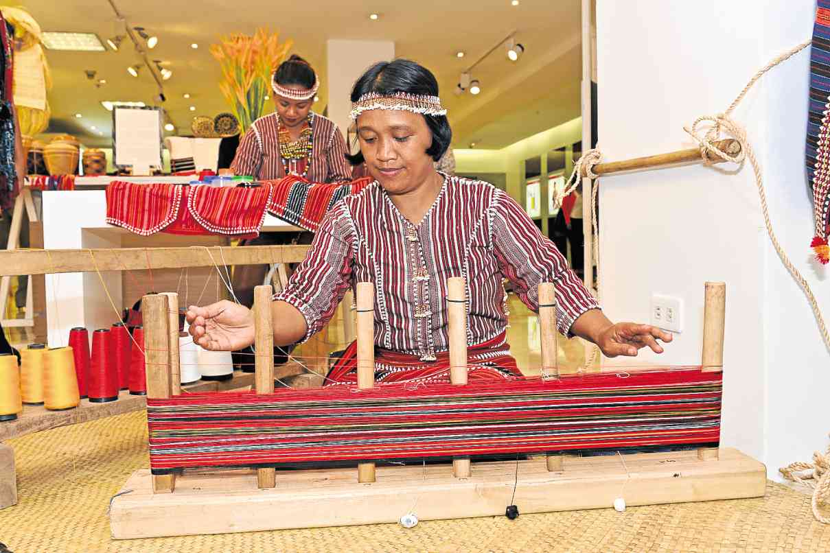 CARINA Amsiwen of Paracelis, Mountain Province, demonstrating traditional Ga’dang cloth weaving